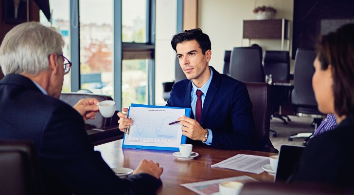 A financial advisor explaining investment performance.