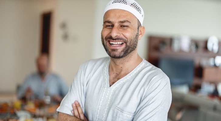 Middle Eastern man who has finished his annual rebalancing.