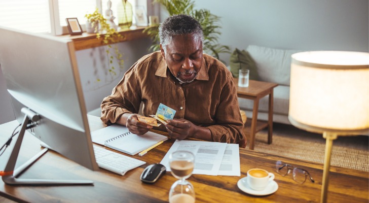Elderly man signs up for Medicare.