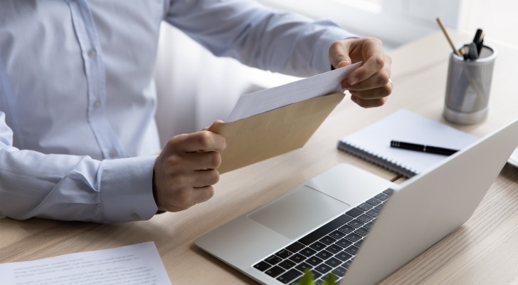 Man opening up the beneficiary forms