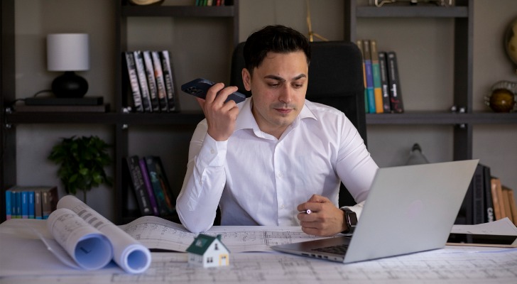 Man investing in real estate online