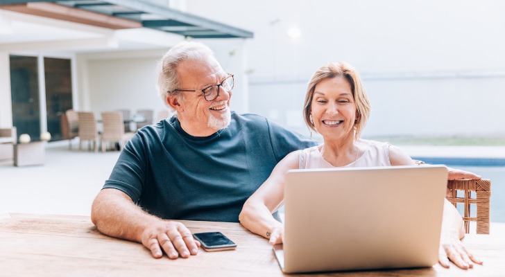 Couple looking at their Amazon dividend payments