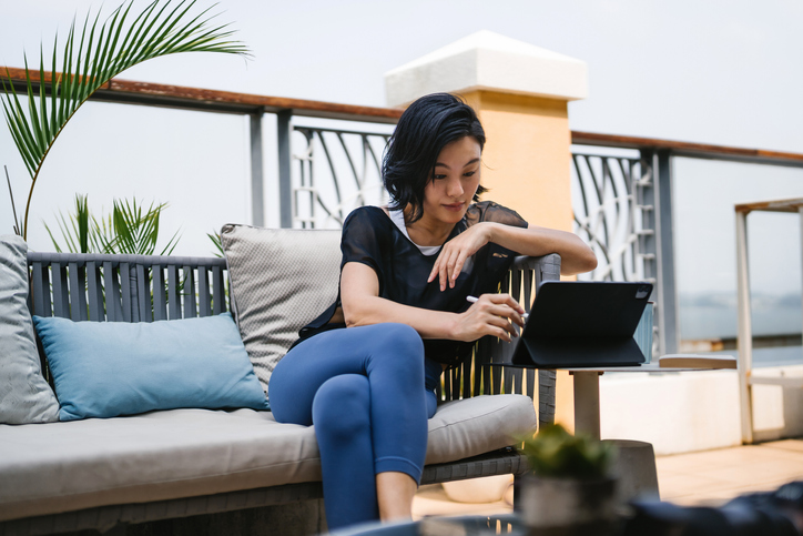 Young woman looks at various annuities on the internet.