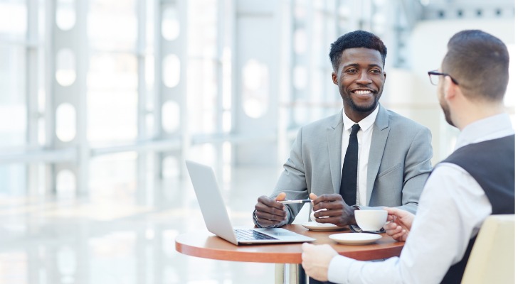 An angel investor meets with the owner of a business he may invest in.