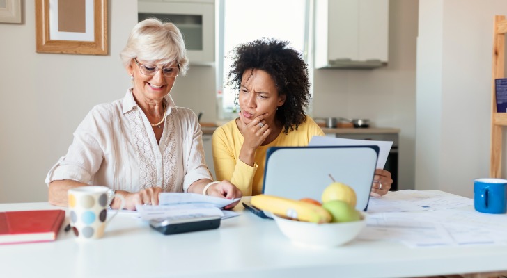 Two women calculating how to retire at 30 with $2 million.