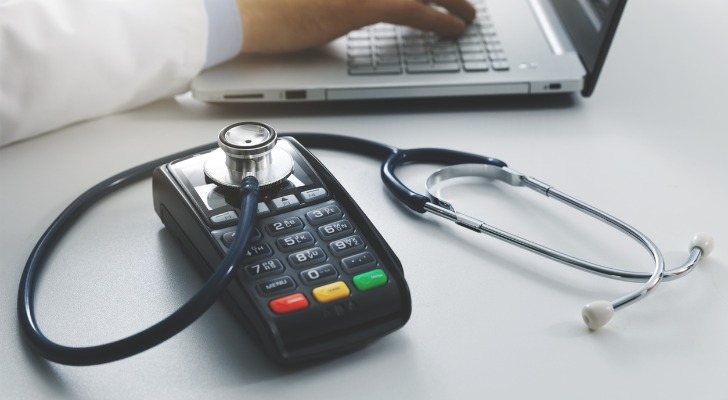 A doctor charging customers.