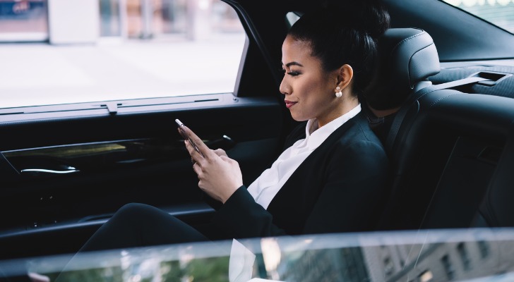 Rich woman texting a prospective financial advisor