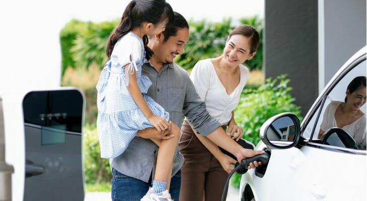 A family charge their electric vehicle.