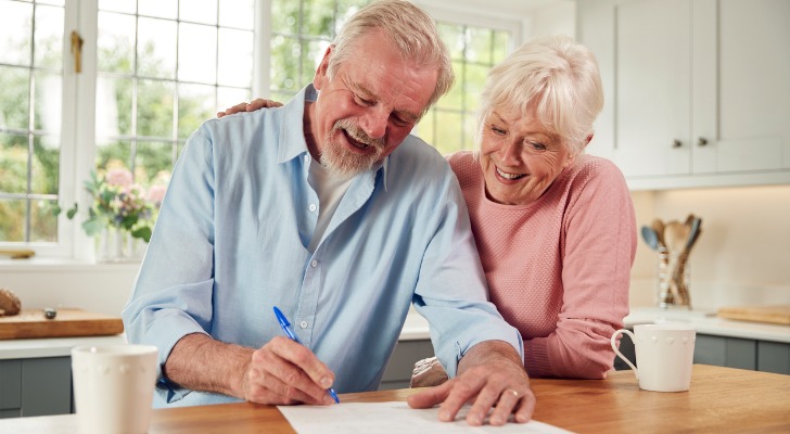 Couple planning out their estate and signing the documentation.