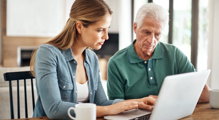 Man and daughter checks his dividend payment