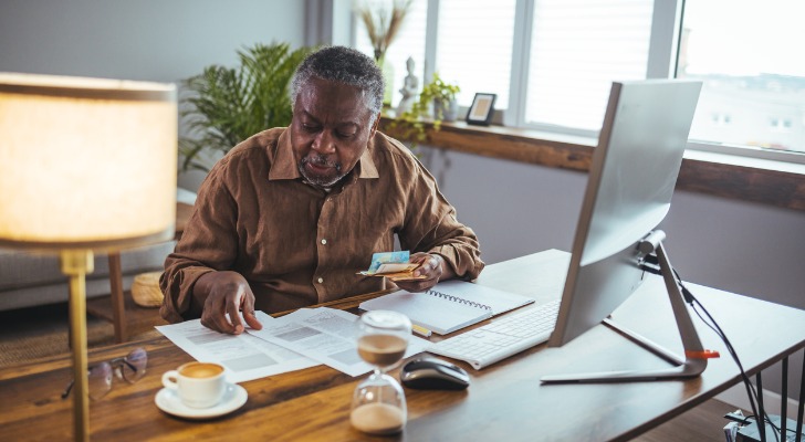 A senior man studying his sources of retirement income