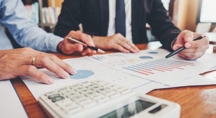 A RIA Custodian going over portfolio performance with financial advisors