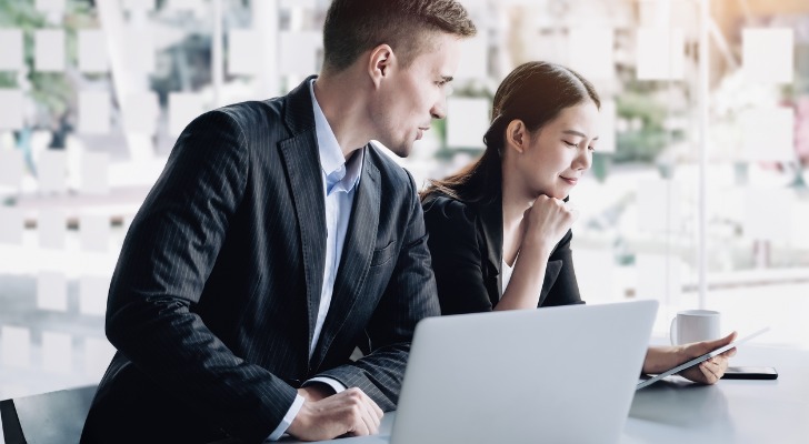 An advisor working with a client on investments.