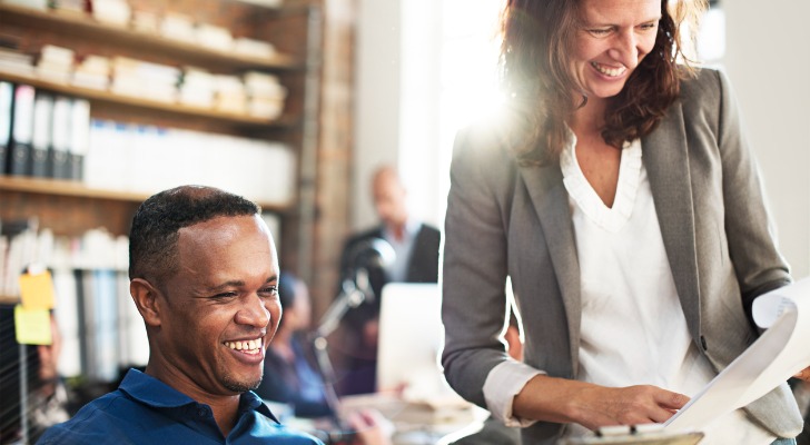Two people excited about the financial performance of the business