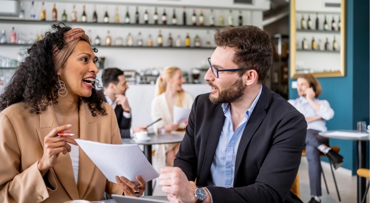 Two people looking at a cash flow statement