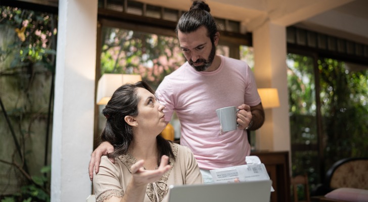 A couple talking about their inability to live within their means