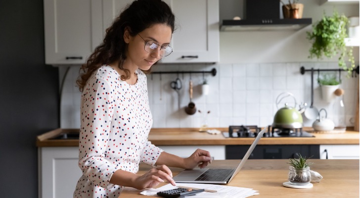 A woman learning what her payout will be as a financial advisor