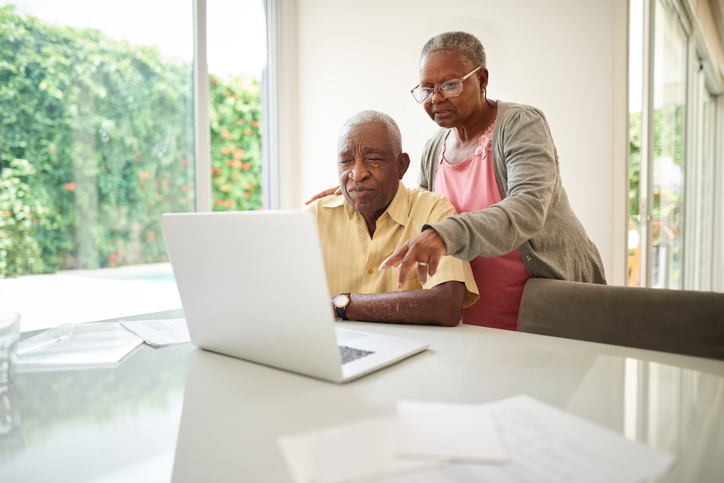 Couple reviews their Roth IRA's performance.