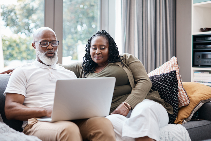 Father and daughter study the family's holdings