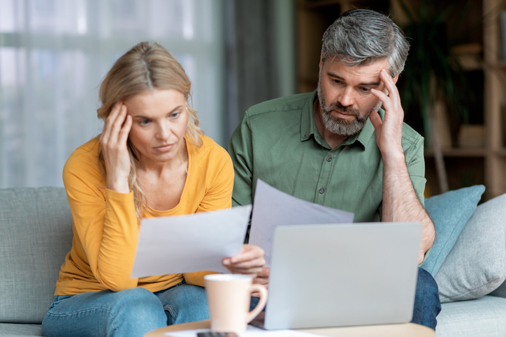 Couple thinking about how to save enough for retirement