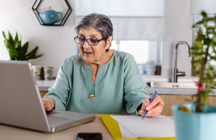 A retired woman prepares to withdraw from her retirement account.