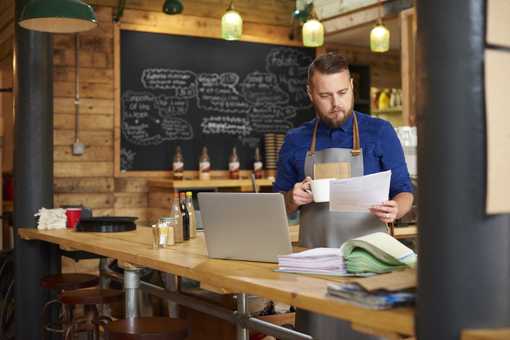 A businessman checks his cash flow