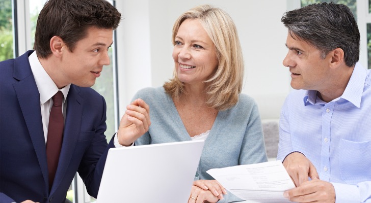 A RIA custodian going over investments with a couple