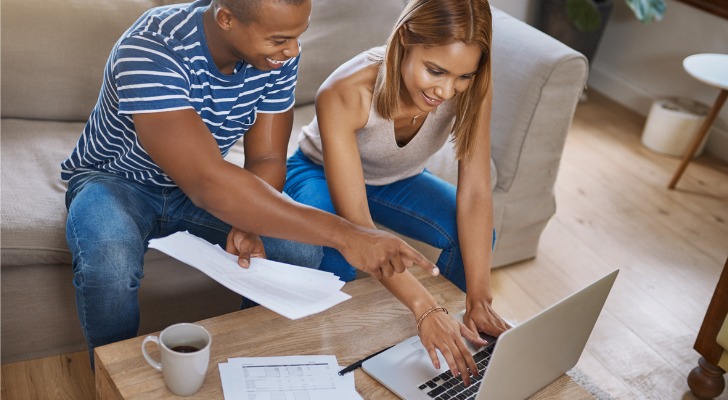 A couple looking at the Gamestop short squeeze.