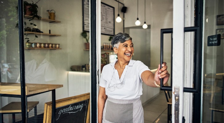 A business owner opens her store.