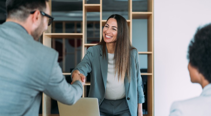 A woman recruiting a financial advisor during an interview
