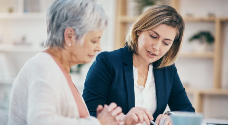 A financial advisor meets with a client.