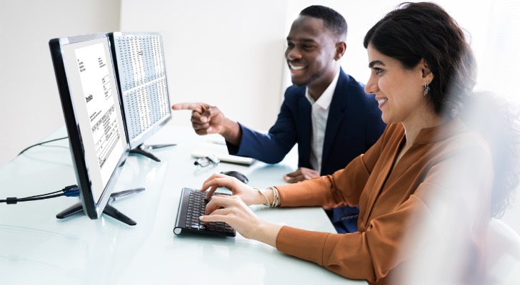 Two RIA advisors looking at their latest software solution