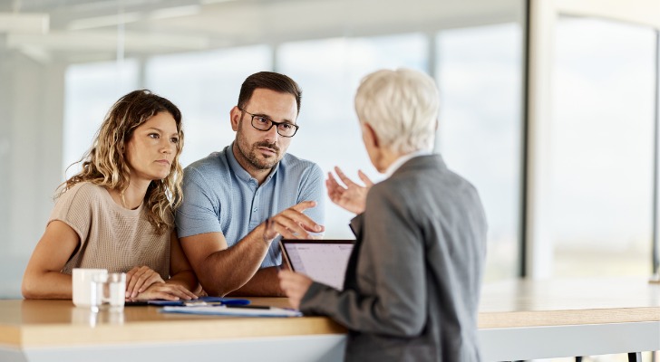 A couple considering DRIP investments.