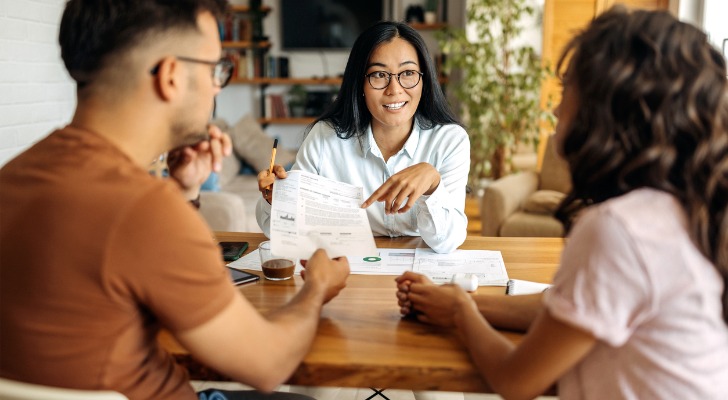 A financial advisor working with a couple in their 20s.