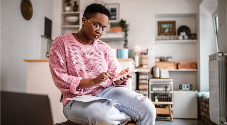 An investor looks over the total expense ratio of a fund in her portfolio.