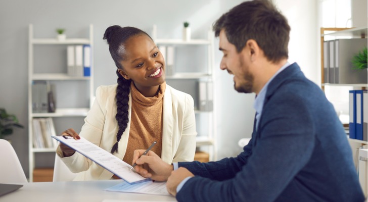 A man buying life insurance after making sure he's not being scammed