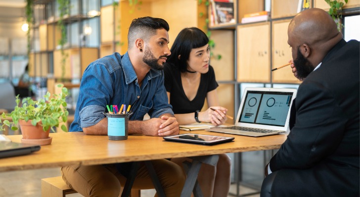 Couple looking at their ESOP and ESPP options