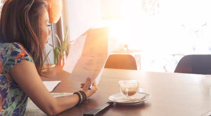 A woman looking at her socially responsible investments.
