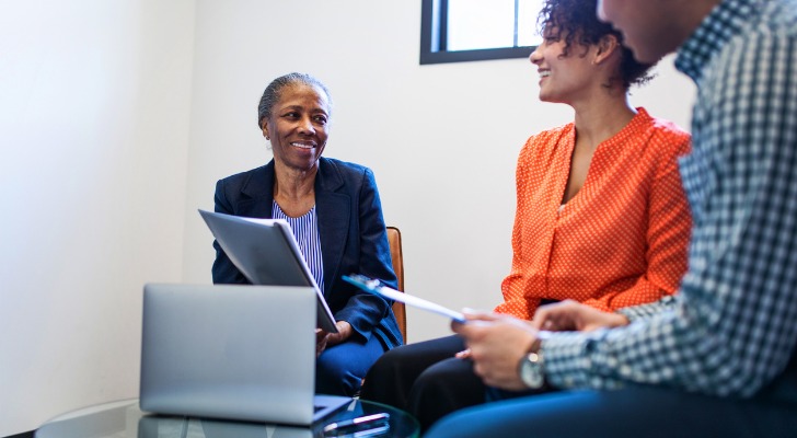 A woman talking to her beneficiaries in her life insurance