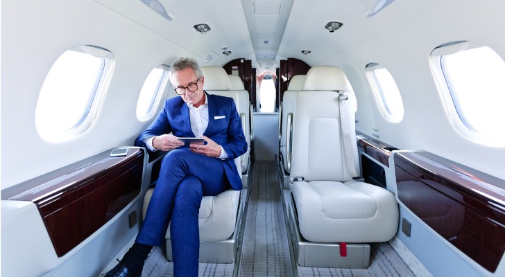 A wealthy businessman looks over potential investment options for his private placement life insurance policy.