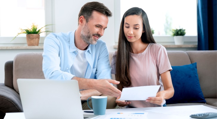 A couple talking about an adjustable life policy