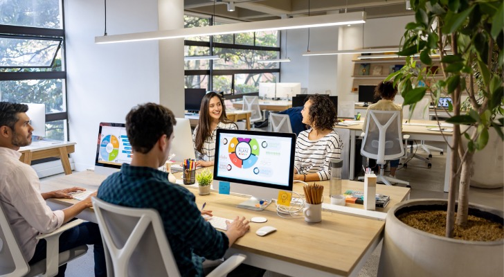 Workers earning non-passive income at an office job.