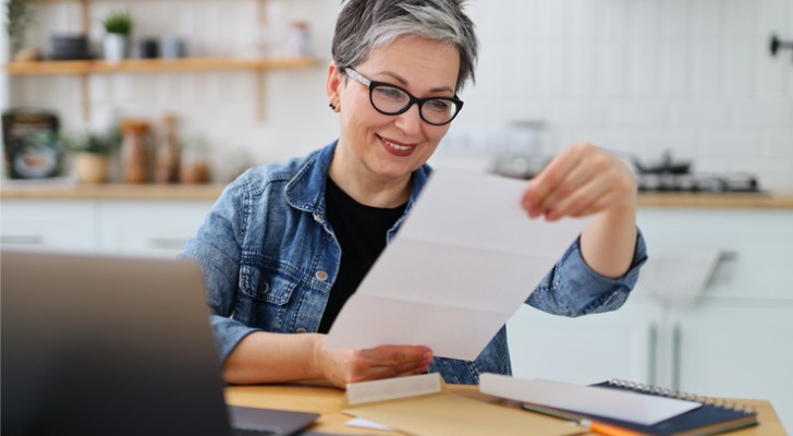 A woman realizing she's been gifted money as a successor beneficiary