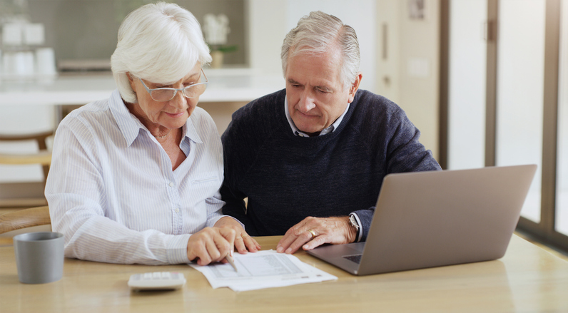 Retired couple analyzes their retirement savings accounts.