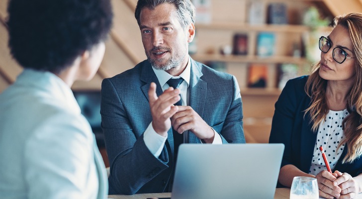 Financial advisor explaining investment strategy to his ultra high net worth clients.