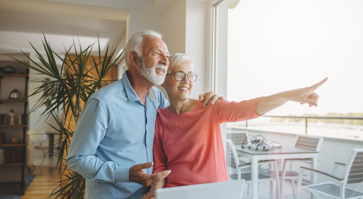 A couple excited for retirement after correctly rolling over their retirement account and calculating their taxes.