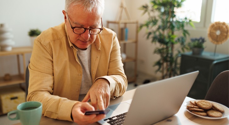 A retired man checking his retirement money market account