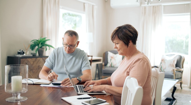 A couple studies their insurance policies