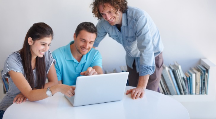 A couple and their advisor discussing life insurance options