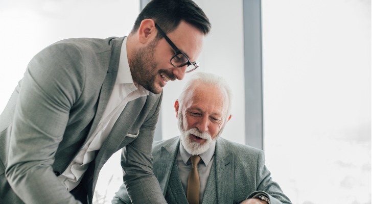 A father and son look over their family limited partnership (FLP) agreement.